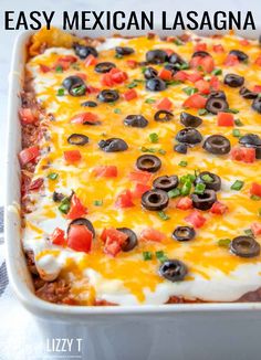 an easy mexican lasagna casserole in a white dish