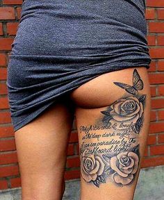 a woman with a tattoo on her thigh