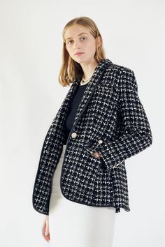 A lesson in polish, this timeless designer tweed blazer is a wardrobe staple, highlighted with pearls buttons lining the front. . Color: Black blended with White. Length: 28 inches. Care: Dry Clean. Composition: Tweed fabric with 60% Wool, 40% Polyester. Sizing:    • Fits true to size    • Designed for a regular fit    • Mid-weight, non-stretchy fabric    • Model is 6 ft. / 182.88 cm and wears a size Small (2) White Tweed Jacket, Checkered Blazer, Checkered Jacket, Tweed Pattern, Black And White Tweed, White Tweed, Tweed Fabric, Tweed Blazer, Professional Outfits