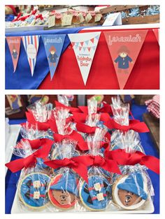 there are some cookies on the table with red and blue ribbons around them, along with other treats