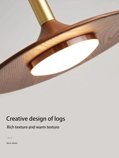 an image of a light fixture with the words creative design of logs written below it