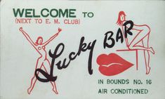 a sign for lucky bar with an image of a woman holding up her arms in the air