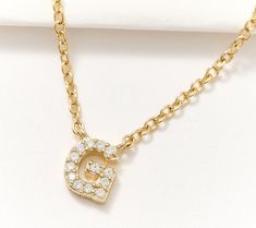 A style that is truly your own, this station necklace pops with personality. It's customized with your initial and encrusted with cubic zirconia Diamonique simulated diamonds for a dazzling display. Yellow Gold Initial Necklace With Cubic Zirconia, Station Necklace, A Style, Yours Truly, Cubic Zirconia, Initials, Gold Plate, Diamonds, Plating