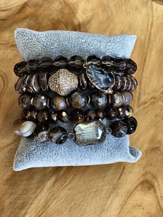 Boho tiger eye beaded stacked five piece bracelet. Features: Boho Stacked Bracelet Tiger Eye One Size Fits All Weight is 5.4 oz. Comes in a jewelry gift box. Pillow not included. Brown Stretch Bracelet With Stackable Round Beads, Brown Stackable Stretch Bracelet With Round Beads, Brown Stackable Bracelet With Round Beads, Brown Stackable Beaded Bracelets Gift, Gift Stackable Brown Beaded Bracelets, Gift Brown Stackable Beaded Bracelets, Brown Faceted Bead Bracelet, Spiritual Brown Stackable Beaded Bracelets, Brown Hand Wrapped Stretch Bracelet For Gift