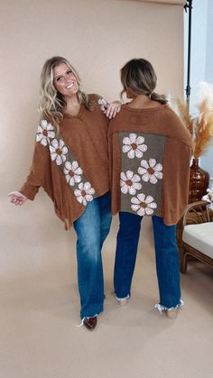 Embrace your fun and flirty side in the Bloom Into You Floral Boho Top! This oversized top features a playful daisy patch on the front and back, adding a pop of color to your fall look. The oversized fit adds a comfortable and carefree vibe to your style. Oversized Top Mineral Washed Daisy Patches Fully Embroidered Pockets 😍 V Neckline Dropped Shoulders Side Slits Asymmetrical Hemline Exposed Seams Frayed Details Measurements/Sizing: (Approximate. Measured lying flat.) ***Oversized fit. Back gr Daisy Patches, Sweatshirt Refashion, Bride Top, Everyday Chic, Exclusive Dress, Oversized Top, Chic Boutique, Boho Tops, Fall Looks