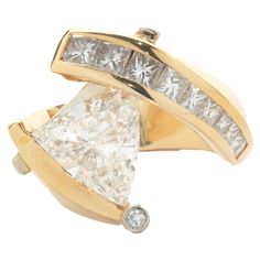 a gold ring with a white diamond in the middle