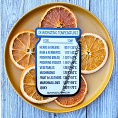 an orange sliced in half on top of a yellow plate with a label that reads dehydrating temperatures