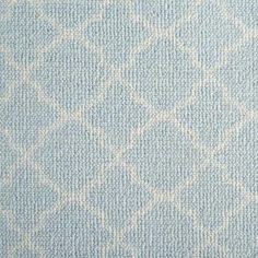 an upholstered blue and white fabric with small squares