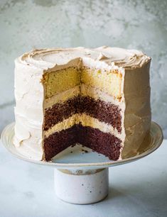 a cake that has been cut in half and is on top of a white plate