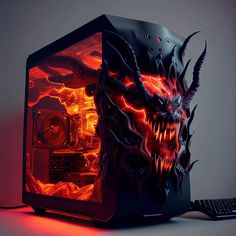 a computer case with a dragon design on the side and a keyboard next to it