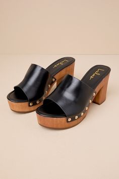 The Lulus Jaylani Black Platform Mule Sandals are the perfect combination of cute and cool for all your warm weather 'fits! Smooth faux leather shapes these essential sandals that have an almond footbed and a wide vamp strap with shiny gold stud accents along the side, all atop a 1.25"" toe platform. Easy slide-on design makes for effortless, everyday styling, while a sturdy wood-look block heel completes the classic clog-inspired look! 3. 75" wood-look block heel. Lightly cushioned insole. Rubb Chic Open Toe Clogs With Cushioned Footbed, Chic Beach Clogs With Heel Strap, Chic Open Toe Clogs For Vacation, Black Mule, Block Heel Mule, Platform Mules, Heeled Mules Sandals, 2024 Style, Platform Block Heels