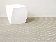 a white table sitting on top of a tiled floor