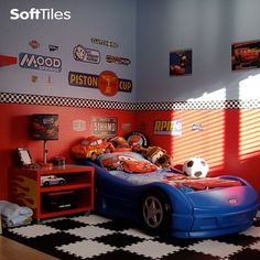 a child's bedroom decorated in red, white and blue with lots of stickers on the walls