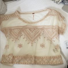 Free People Ivory Mesh Shirt With Embroidered Pattern Never Worn, Still Has Tag! Beige Short Sleeve Tops With Floral Embroidery, Cream Short Sleeve Tops With Floral Embroidery, Fitted Embroidered Beige Top, Cream Crew Neck Top With Floral Embroidery, Beige Short Sleeve Embroidered Tops, Beige Embroidered Short Sleeve Top, Cream Embroidered Short Sleeve Blouse, Fitted Cream Tops With Floral Embroidery, Red Tunic Top