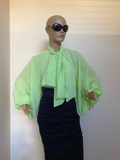 "Amazing and extravagant chiffon green blouse with bow tie collar. Rich puffy sleeves. Elegant and extravagant, perfect for your special occasions. Would fits best for sizes L or XL SIZE L - US 10, UK 12, EU 40 bust: bust around 39.5\"/100cm Waist: waist around 31.5\"/80cm Hips: hips around 39.5\"/100cm SIZE XL - US 12, UK 14 , EU42 bust: bust around 41.5\"/105cm Waist: waist around 33.5\"/85cm Hips: hips around 41.5\"/105cm" Green Summer Blouse For The Office, Green Summer Blouse For Office, Green Summer Office Blouse, Bishop Sleeve Tops For Summer Parties, Summer Party Tops With Bishop Sleeves, Elegant Long Sleeve Green Blouse, Elegant Green Tops For Party, Green Balloon Sleeve Blouse For Summer, Spring Evening Blouse With Lantern Sleeves