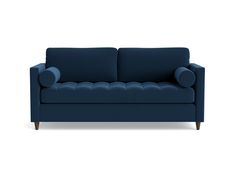 a blue couch sitting on top of a white floor