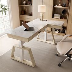 a desk with a laptop on it in a room