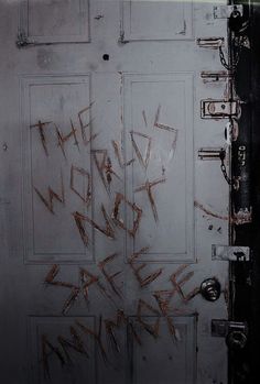 an open door with graffiti written on it