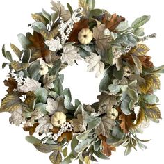 a wreath with leaves and apples on it