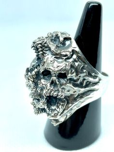 Jewel made entirely by hand by the Italian craftsman Gianmarco Fontana. Ring made of 925 Silver, which is part of the "SKULLS" collection depicting Paranoia. This ring represents the transformation and progression of Paranoia. Psychosis characterized by the development of a chronic, coherent delusion, which evolves slowly, leaving the remaining psychic functions intact. Formal Hand Cast Sterling Silver Rings, Artistic Hand Cast Sterling Silver Rings, Sterling Silver Hallmarked Skull Ring Collectible, Symbolic Hallmarked Skull Ring For Anniversary, Unique Sterling Silver Skull Ring With Polished Finish, Unique Engraved Ring With Lost Wax Casting For Collectors, Sterling Silver Rings With Unique Design For Formal Events, Unique Collectible Engraved Ring With Lost Wax Casting, Sterling Silver Rings With Unique Design For Formal Occasions