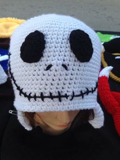 a crocheted skull hat with black eyes