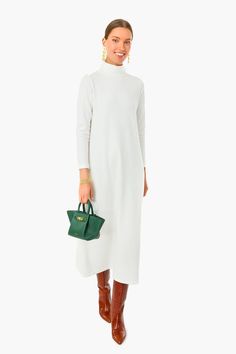 Winter whites anyone? Chic understated glamour meets the Pearled Ivory Ellery Dress. With a turtleneck, three-quarter length sleeves, and an A-line fit, this maxi is the epitome of elegance and class. Whether youâre window shopping or heading to your favorite restaurant with friends, pair this sweet, sweater stunner with gold accessories and a tote bag that pops for a timeless look. Turtleneck Three-quarter length sleeves A-line silhouette Maxi length Sweater dress style Material: 48% Viscose, White Maxi Dress For Evening In Winter, White Maxi Dress For Winter Evening, Elegant White Turtleneck Dress, Chic White High Neck Midi Dress, Elegant White High Neck Maxi Dress, White High Neck Midi Dress For Fall, White High Neck Maxi Dress For Spring, White Midi Dress For Evening In Fall, White Winter Maxi Dress