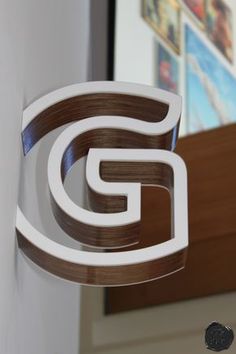 a close up of the letter g on a wall