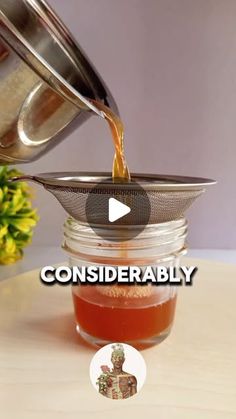 a jar filled with liquid sitting on top of a table