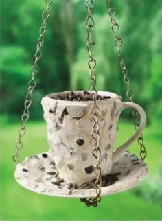 a coffee cup hanging from a chain