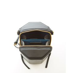 This black leather bucket bag comes with an unexpected geometric shape. This chic small bucket handbag has a playful but sophisticated runway savvy look. With its gold hardware, its small handle allows the Octagon to swivel and be held in hand as a bucket. Its top zipper will keep your contents secure inside, while the cotton lined interior with 3 compartments keeps everything organized. This classy designer crossover barrel purse comes with a long and comfortable leather strap that can be flung Luxury Evening Bucket Satchel, Modern Bucket Bag With Gold-tone Hardware For Travel, Modern Travel Bucket Bag With Gold-tone Hardware, Modern Black Bucket Bag With Gold-tone Hardware, Modern Bucket Bag With Zipper Closure For Evening, Modern Bucket Bag With Zipper Closure, Modern Evening Bucket Bag With Zipper Closure, Formal Bucket Shoulder Bag With Zipper Closure, Black Bucket Bag