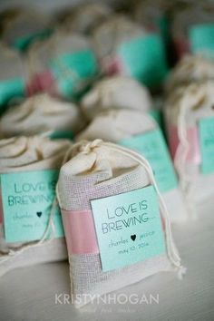 small bags filled with love is brewing soap on top of a white table cloth covered in burlap