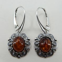 This is a pair of genuine and beautiful Baltic Amber Earrings in 925 Sterling Silver. The silver does not include any nickel or other metals causing most allergies and thus the earrings are hypoallergenic.  The earrings are made right in the world capital of amber: Gdańsk / Danzig, Poland. Size of one Earring 3.4 x 1.5 cm 1.34 x 0.59 inch Weight of both Earrings 4.0 grams 0.14 oz You will receive the item in a gift box - perfect to surprise someone or yourself. Usually we ship on the same day we Amber Polished Sterling Silver Jewelry, Hypoallergenic Sterling Silver Amber Earrings, Silver Baltic Amber Oval Jewelry, Amber Sterling Silver Dangle Earrings, Silver Baltic Amber Earrings, Amber Earrings, Happy Customer, Baltic Amber, Fine Jewellery Earrings