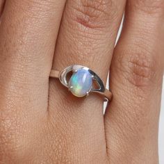 "Ethiopian Opal Ring, 925 Sterling Silver Ring, Oval Gemstone Ring, Women Silver Jewelry, Handmade Ring, Bohemian Ring, Birthday Gift for Her Gemstone Name - Ethiopian Opal  Stone Quality - AAA  Weight - 2.13 gm Stone Shape - As shown in the picture Ring Size - All Ring Size Available  We serve complete 925 sterling silver Jewelry and genuine properties of the stone. The products are dispatched from the small business from UK.  Product Quality and Packaging - Our all products are 925 Silver Stam Opal Band, Ethiopian Opal Ring, Bohemian Ring, Hippy Gifts, Bohemian Rings, Sacral Chakra, Ring Oval, Silver Jewelry Handmade, Ring Women