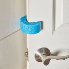 a door handle with a blue sponge on it