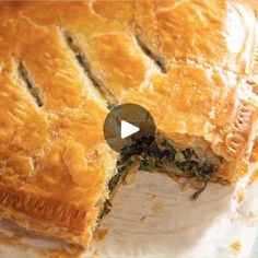 a close up of a pie on a plate with a piece missing from it's crust