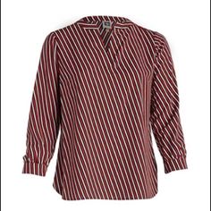 Oblique Stripes And A High-Low Hem Create The Polished Appeal Of This Long Sleeve Blouse From Anne Klein. Product Details Pullover Split Neck Long Sleeves With Cuffs Imported Product Specifications 29.5 In Length Material & Care Woven Polyester Hand Wash Red V-neck Top For Office, Casual Striped Blouse For Business Casual, Casual Striped Blouse For Work, V-neck Blouse For Business Casual, Fall Season, V-neck Blouse For Business Casual In Fall, Fall V-neck Blouse For Business Casual, Fall V-neck Business Casual Blouse, Casual Striped Tops For Office Wear, Striped V-neck Blouse For Fall