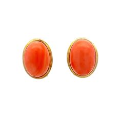 Cabochon Coral Earring Studs in Yellow Gold Add a splash of vibrant color to your accessories with these elegant stud earrings. Each earring features an impressive oval cabochon-cut coral gemstone, weighing 6.40 carats. The coral are bezel set in 14 karat yellow gold, creating a seamless and secure setting that highlights their natural beauty. Perfect for both casual and formal occasions, these earrings are designed to stand out without being overwhelming. The warm hue of the coral beautifully complements the yellow gold and brings out the color. PRIMARY STONE Stone: Coral Shape: Cabochon/Oval Weight: 12.80 ct Measurements: 14.40 mm x 10.78 mm x 5.70 mm = 6.4 ct (2) CHARACTERISTICS Measurements: 15.90 mm x 12.20 mm Era: Modern Composition: 14 Karat Yellow Gold Total Gram Weight: 4.1 g Insc Classic Oval Cabochon Clip-on Earrings, Elegant Coral Oval Jewelry, Elegant Oval Coral Jewelry, Fine Jewelry Oval Cabochon Earrings, Classic Oval Cabochon Gemstone Earrings, Formal Coral Oval Jewelry, Oval Cabochon Clip-on Earrings Gift, Coral Oval Cabochon Jewelry, Oval Coral Cabochon Jewelry