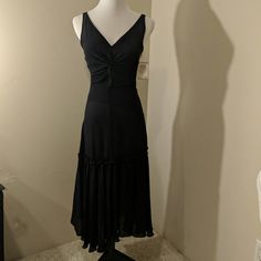 Gorgeous Black V Neck Sleeveless Dress. Fully Lined Shift Dress With Hidden Side Zipper. Size 40 (6). Approx Dimensions 14" Chest X 44" Length. New With Tag. Black Ruched Sleeveless Midi Dress, Sleeveless Midi Dress With Flattering Silhouette For Evening, Black Fit And Flare Ruched Dresses, Black Ruched Fit And Flare Dress, Elegant Black Ruched Sleeveless Dress, Sleeveless Fit And Flare Midi Dress For Date Night, Fitted V-neck Sleeveless Evening Dress, Fitted Black Sleeveless Lined Dress, Black Fitted Sleeveless Lined Dress