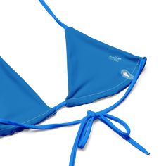 Stay comfortable and beach ready all summer in this FYC String Bikini set. It’s made from soft recycled polyester with double-layering and UPF 50+. Style the straps how you like, and get ready to swim! • Soft and stretchy material with UPF 50+ • Sizes up to 4XL • Bikini top comes with removable padding for comfort • Multiple ways to tie and style the bikini set Disclaimer: To make your All-Over Print Recycled String Bikini last longer, thoroughly rinse it off after each use and get rid of any ch Nylon Swimwear With 4-way Stretch For Water Sports, Beachy Nylon Swimwear For Sunbathing, Adjustable Straps Beachwear Swimwear, Vacation Swimwear With Adjustable Straps And Stretch, Adjustable Swimwear For Sunbathing Beachwear, Seamless Nylon Swimwear For Water Sports, Adjustable Summer Swimwear With Uv Protection, Summer Triangle Top Swimwear In Nylon, Nylon Swimwear For Water Sports Beach Season