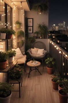 the balcony is decorated with potted plants and lights