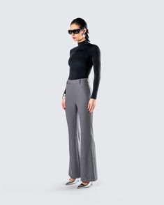 It’s giving CEO 🙌 Boss them around in this chic two-piece set. Featuring a black mockneck top and a pair of grey flared trouser pants, this fit will have them all following your orders 😏 Chic Stretch Gray Wide Leg Pants, Chic Gray Stretch Wide Leg Pants, Chic Fitted Gray Wide Leg Pants, Chic Gray Wide Leg Full Length Pants, Fitted Wide Leg Pants In Gray For Fall, Chic Gray Wide Leg Pants For Formal Occasions, Elegant Gray Wide Leg Pants For Business Casual, Chic Gray Wide Leg Pants For Fall, Fitted Gray Wide Leg Pants For Office