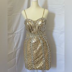 Elegant Fits Small/Medium Gold Sparkling Sequin Dress For Cocktail, Gold Evening Dress For Cocktail Holiday, Sparkling Gold Sequin Dress For Formal Events, Gold Sparkling Sequin Dress For Formal Occasions, Formal Sparkling Gold Sequin Dress, Formal Gold Sparkling Sequin Dress, Gold Mini Dress For Festive Formal Occasions, Festive Gold Mini Dress For Formal Events, Formal Gold Mini Dress With Sequins