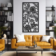 a living room with yellow leather couches and black metal wall art on the wall