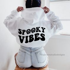 Spooky Vibes Hoodie Halloween Hoodie Fall Hoodie Oversized Hoodie Trendy Hoodie Halloween Sweatshirt Funny Halloween Gift Halloween Clothing This halloween hoodie and halloween crewneck sweatshirt is perfect for anyone that needs a cozy go to hoodie/sweatshirt to curl up in. So go for one that's soft, smooth, and stylish. It's the perfect choice for cooler evenings! ** ADD ON GHOST** This style comes with only a back design. If you want to add a ghost to the front, add this listing to your cart Halloween Hoodies, Halloween Clothing, Halloween Crewneck, Hoodie Oversize, Halloween Hoodie, Fall Hoodies, Fall Clothes, Spooky Vibes, Halloween Sweatshirt