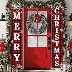 a red door decorated with christmas decorations and wreaths