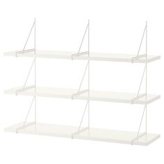 three white shelves with wire on each side and one shelf above the other, in front of