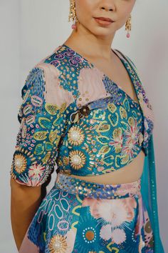 Turquoise lehenga with ocean print and bead embroidery. Paired with V neck blouse and dupatta.
Component: 3
Pattern: Printed, Embroidery
Type Of Work: Ocean, bead
Neckline: V neck
Sleeve Type: Half
Fabric: Imported Satin, Organza
Color: Blue, Green
Other Details: 
Inverted V hem
Note: Outfit worn by the model on right is not for sale
Closure: Blouse: Hook and eye
Occasion: Wedding - Aza Fashions Turquoise Lehenga, V Neck Lehenga, Printed Embroidery, Luxury Sale, Beaded Neckline, Ocean Print, V Neck Blouse, Bead Embroidery, Set For Women