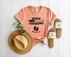 baby loading please wait t - shirt with hat and sandals on white wood flooring