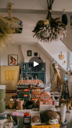 a living room filled with furniture and lots of clutter