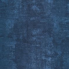 an old blue carpet with some stains on it